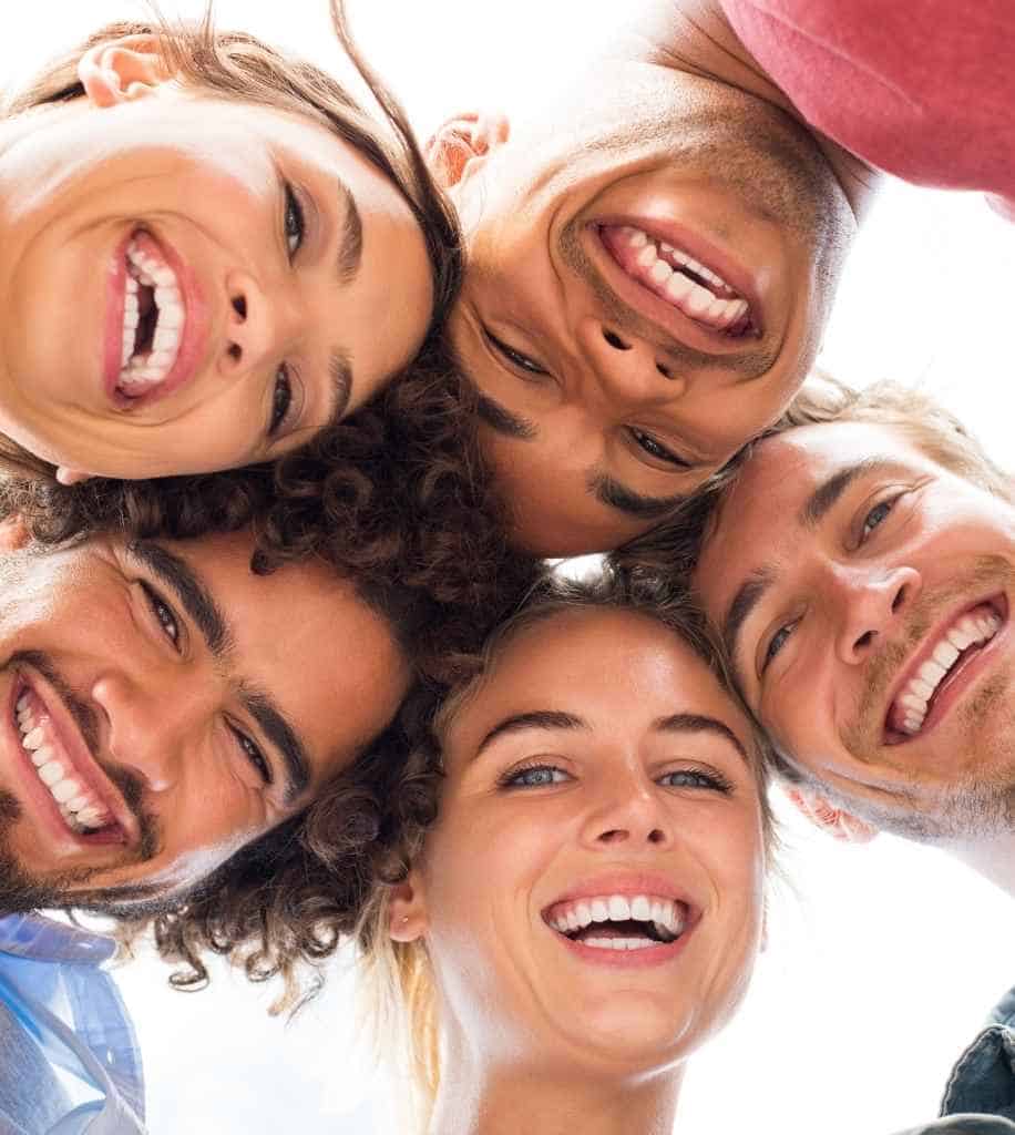 Smiling person showcasing white teeth after laser whitening treatment Blackburn