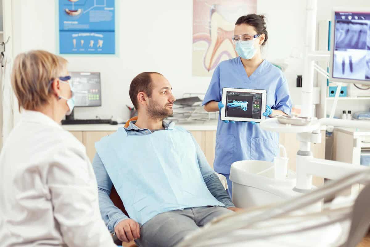 Laser teeth whitening treatment being applied by a dental professional Blackburn